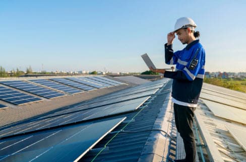 Solar panels mounted on an asphalt shingle roof after a solar panel installation.