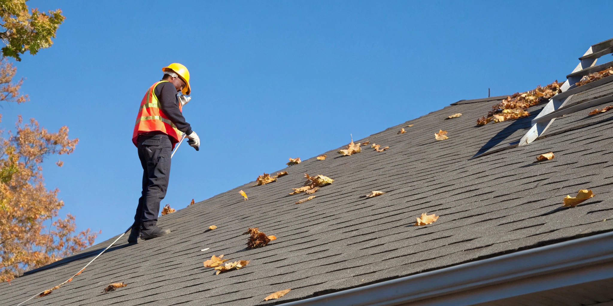 Roof inspector assessing hail damage for an insurance claim.